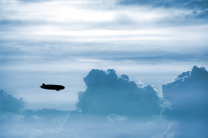 The zeppelin glides through the clouds