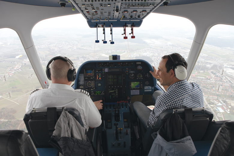The pilot and a scientist in the cockpit