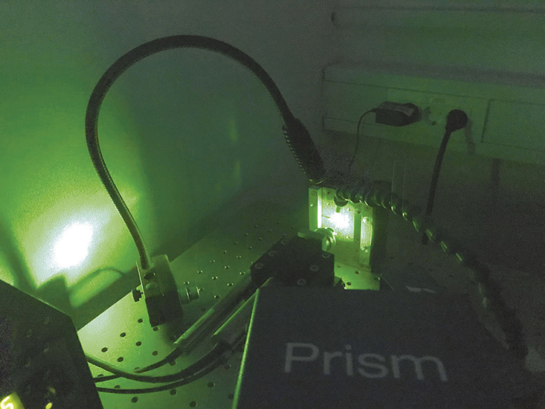 The material is initially treated using "laser shock peening". Short light pulses of the quare laser convert the surface material into plasma. The spreading plasma produces shock waves that generate or modify residual stress. In order to measure the residual stress after treatment, small holes are bored into the "peened" material. Photo: Hereon/Gesa Seidel